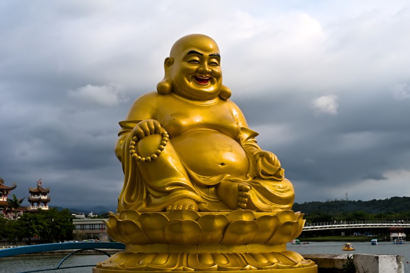 The Smiling Mystic: History, Meaning, and Symbolism of the Laughing Buddha